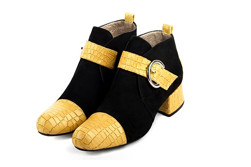 Mustard yellow and matt black women's ankle boots with buckles at the front. Round toe. Low flare heels. Front view - Florence KOOIJMAN